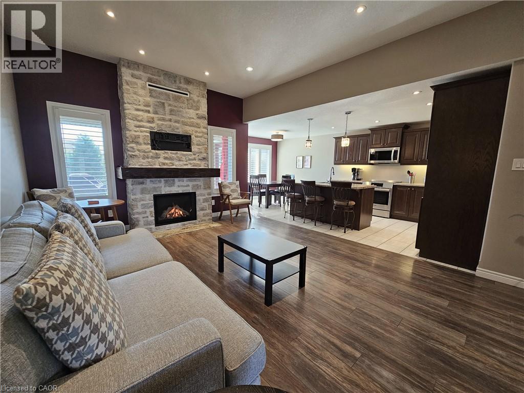 Custom Kitchen off Great Room - 98 Allandale Crescent, Simcoe, ON - Indoor Photo Showing Living Room With Fireplace