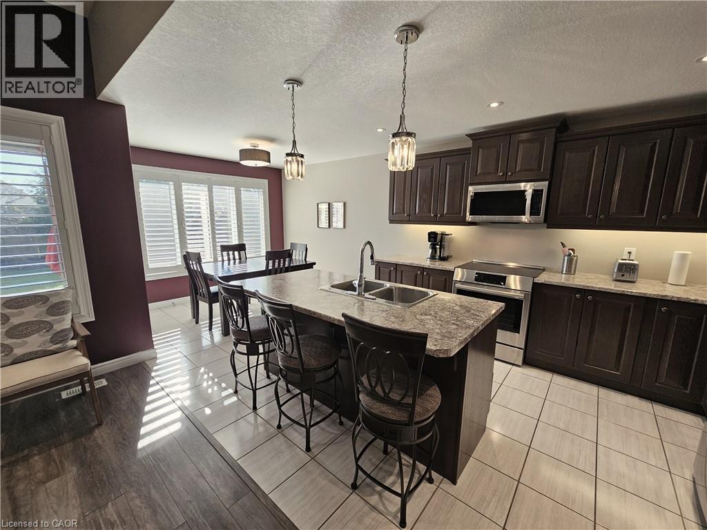 Eat-in Kitchen - 98 Allandale Crescent, Simcoe, ON - Indoor Photo Showing Kitchen With Stainless Steel Kitchen With Double Sink