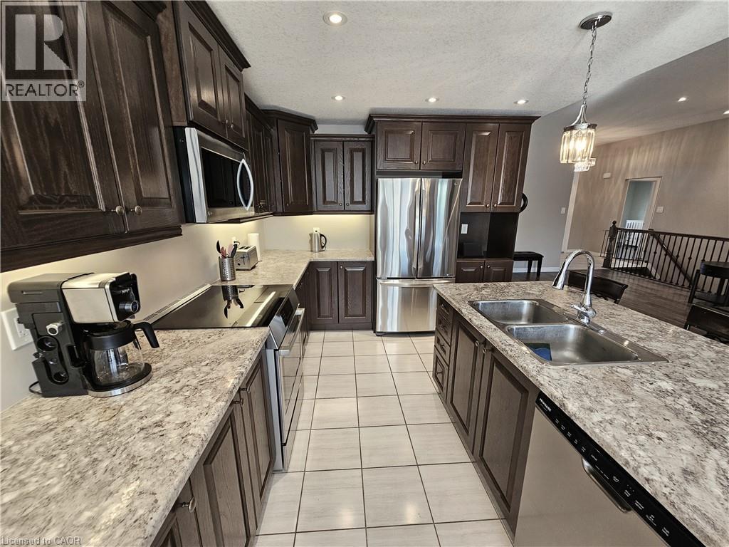 Under-cabinet lighting - 98 Allandale Crescent, Simcoe, ON - Indoor Photo Showing Kitchen With Stainless Steel Kitchen With Double Sink With Upgraded Kitchen