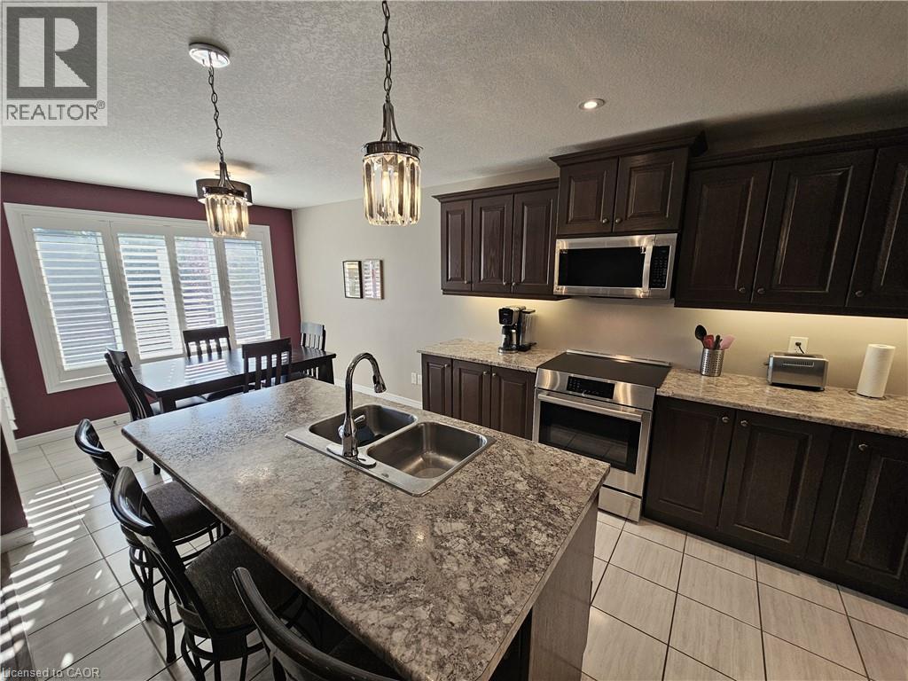 Eat-in Kitchen - 98 Allandale Crescent, Simcoe, ON - Indoor Photo Showing Kitchen With Double Sink