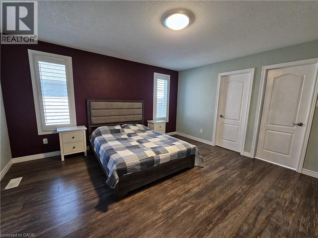 Primary Bedroom with ensuite & walk-in closet - 98 Allandale Crescent, Simcoe, ON - Indoor Photo Showing Bedroom