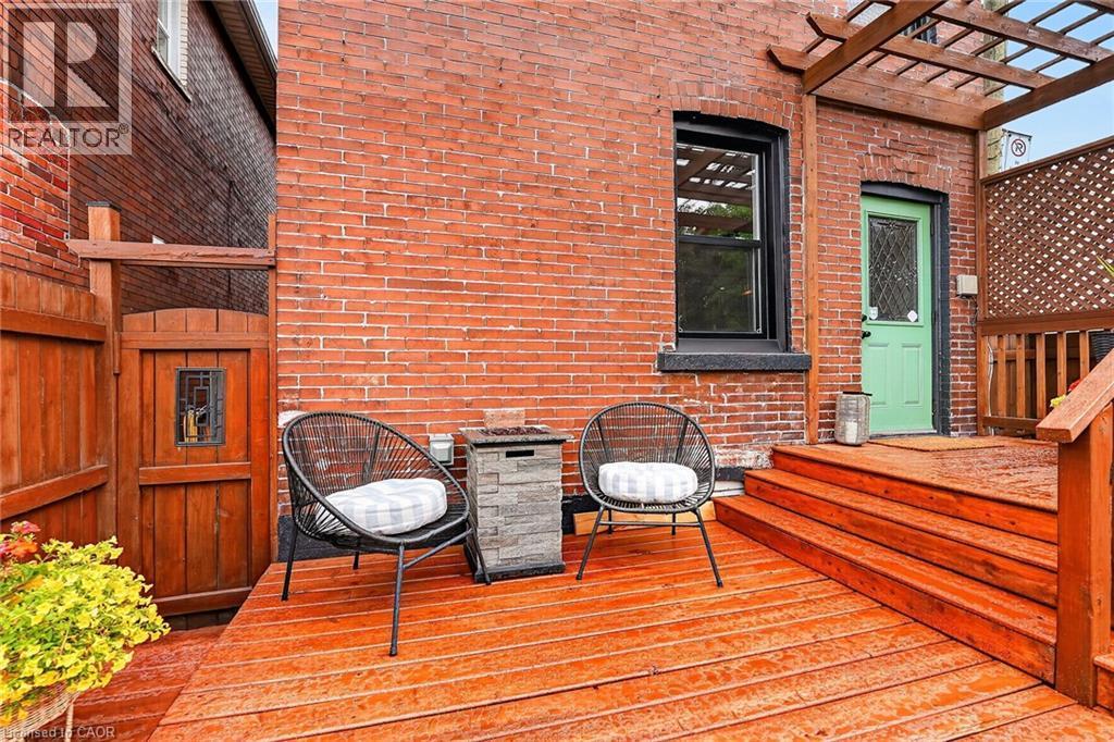 Redwood deck with three steps and a pergola accent - 26 Campbell Avenue, Hamilton, ON