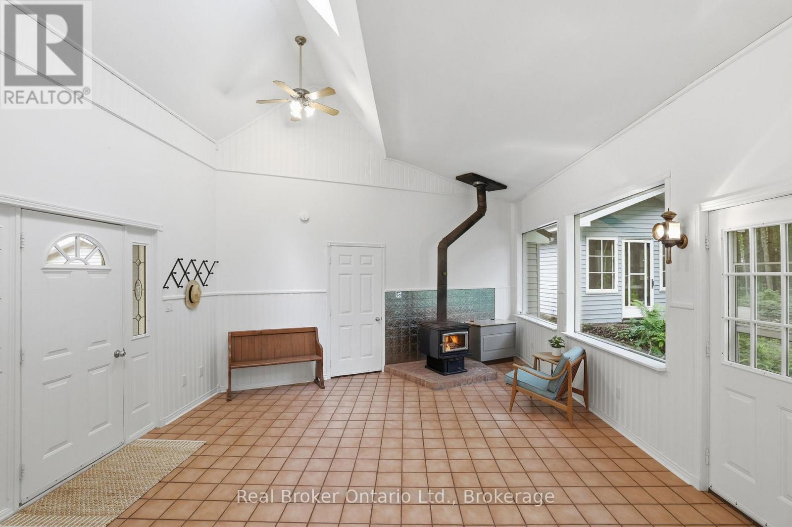 Mudroom with wood stove - 805500 25 Side Road, Grey Highlands, ON