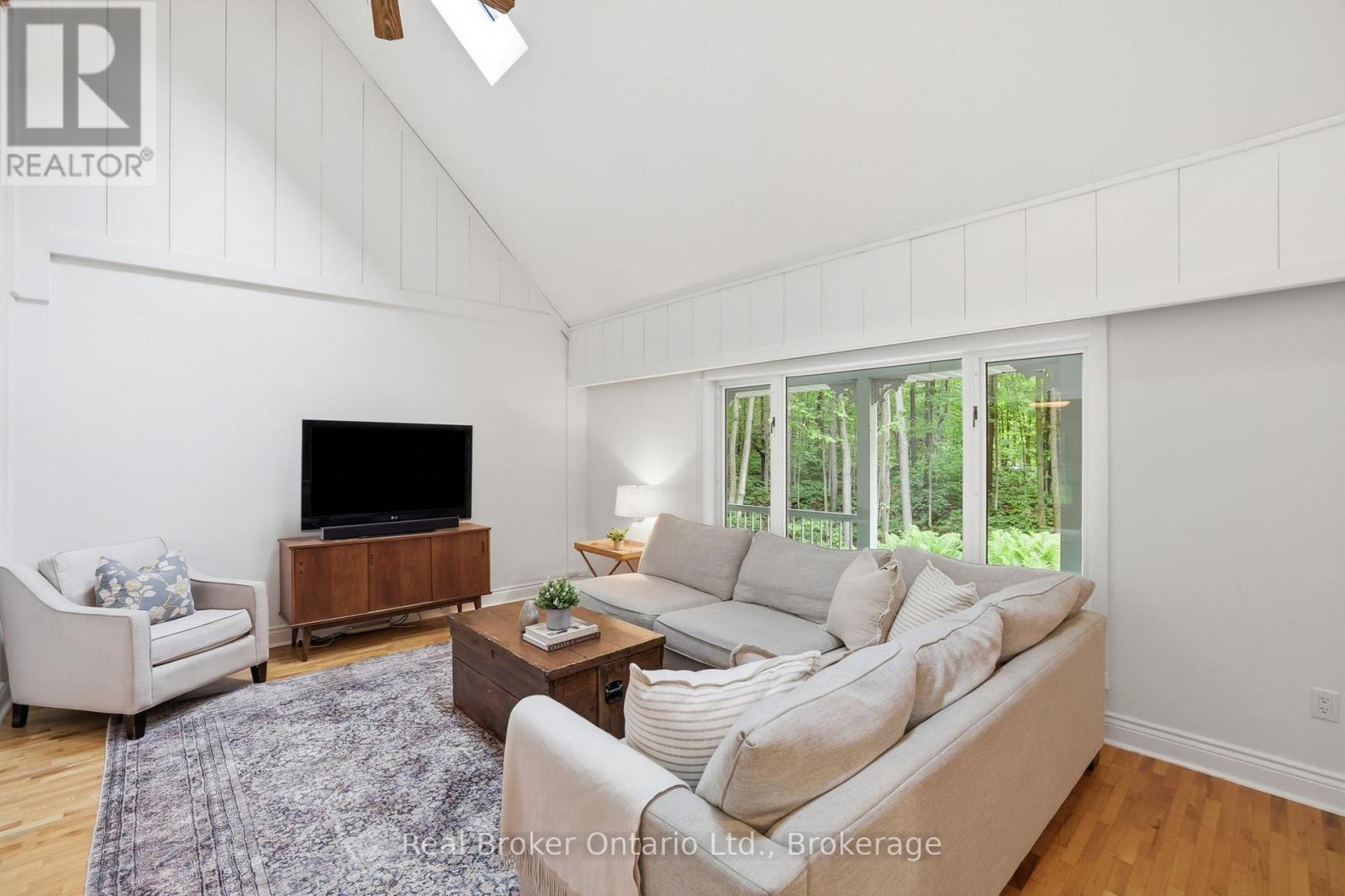 Living room w/ cathedral ceilings - 805500 25 Side Road, Grey Highlands, ON