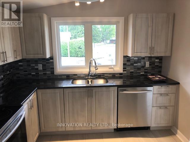 Main level kitchen with stainless appliances - 2329 Ryder Street, Ottawa, ON