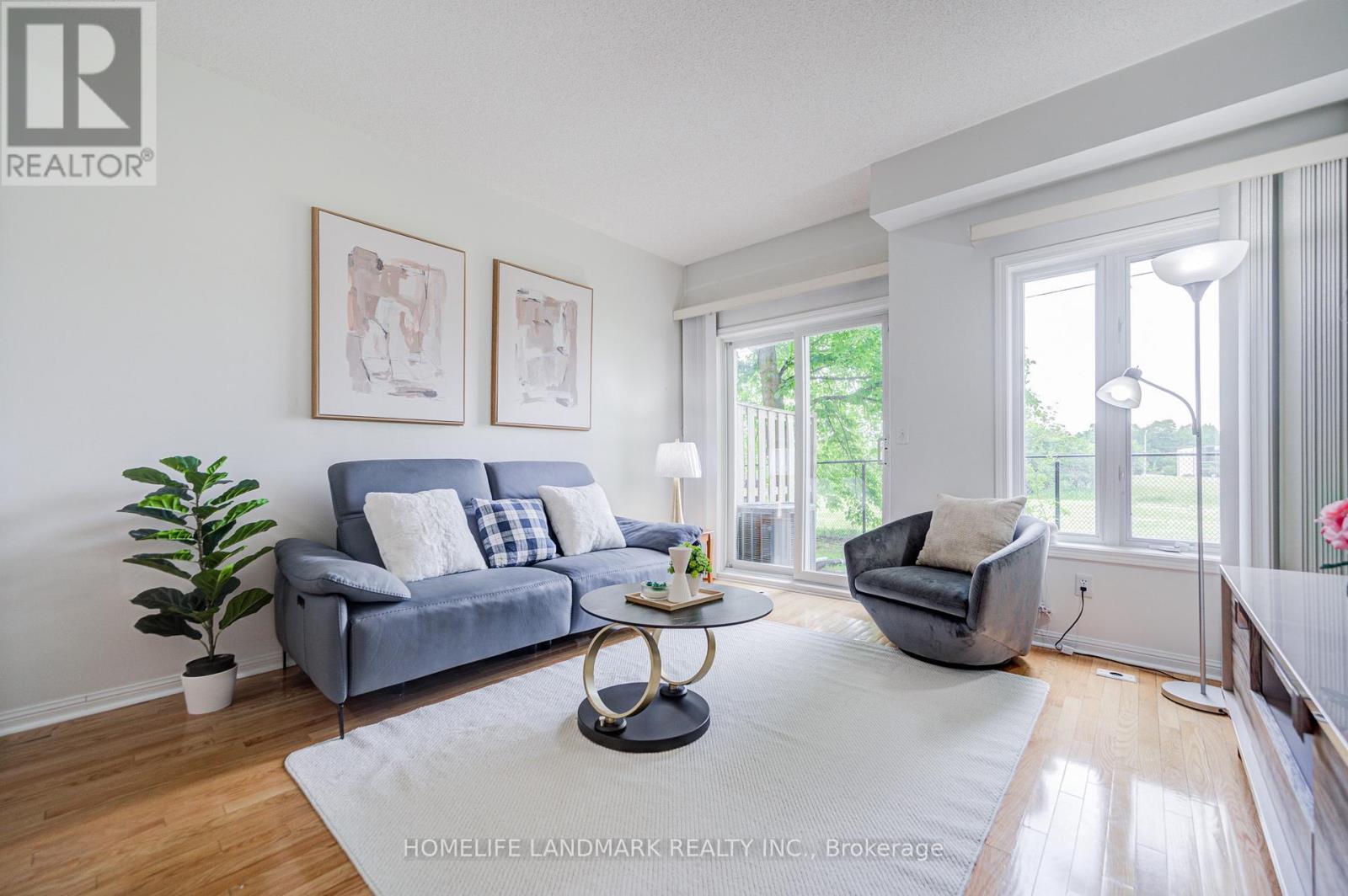 6 - 10 St Moritz Way, Markham, ON - Indoor Photo Showing Living Room