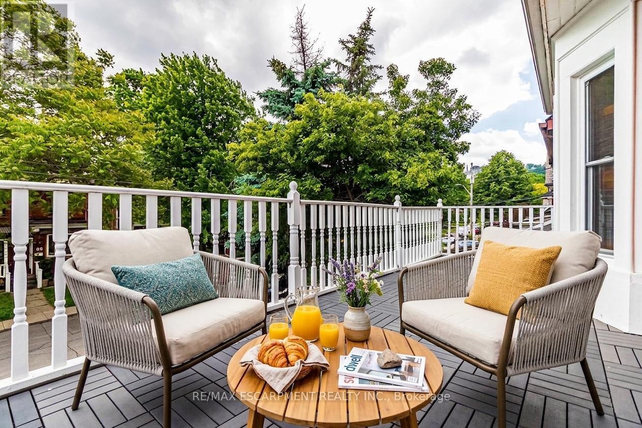 Front Balcony Virtually Staged from Bedroom - 82 Burris Street, Hamilton, ON