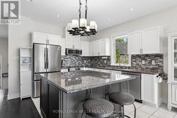 Oversized island perfect for prep and gathering. - 