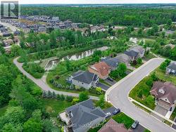 Backing onto greenspace with pond. - 