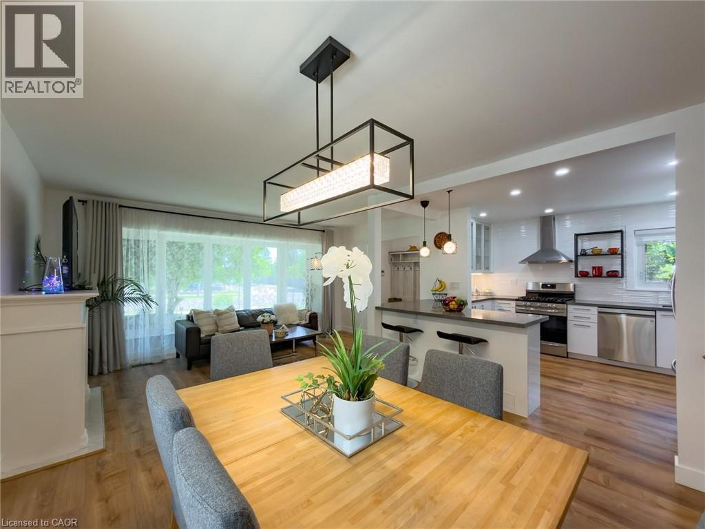 Open-concept interior featuring light wood-finish flooring throughout - 1324 Bodley Road, Mississauga, ON