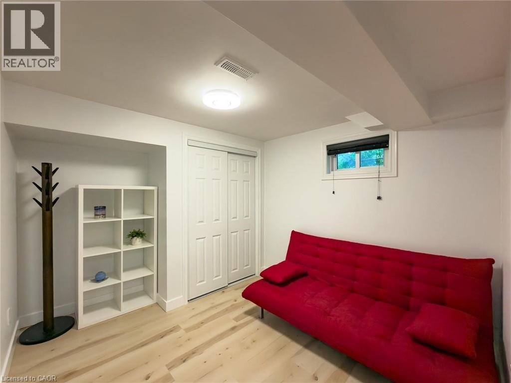 Room featuring light wood-finish flooring and a white color palette - 1324 Bodley Road, Mississauga, ON