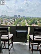Balcony with grey railing and urban landscape -