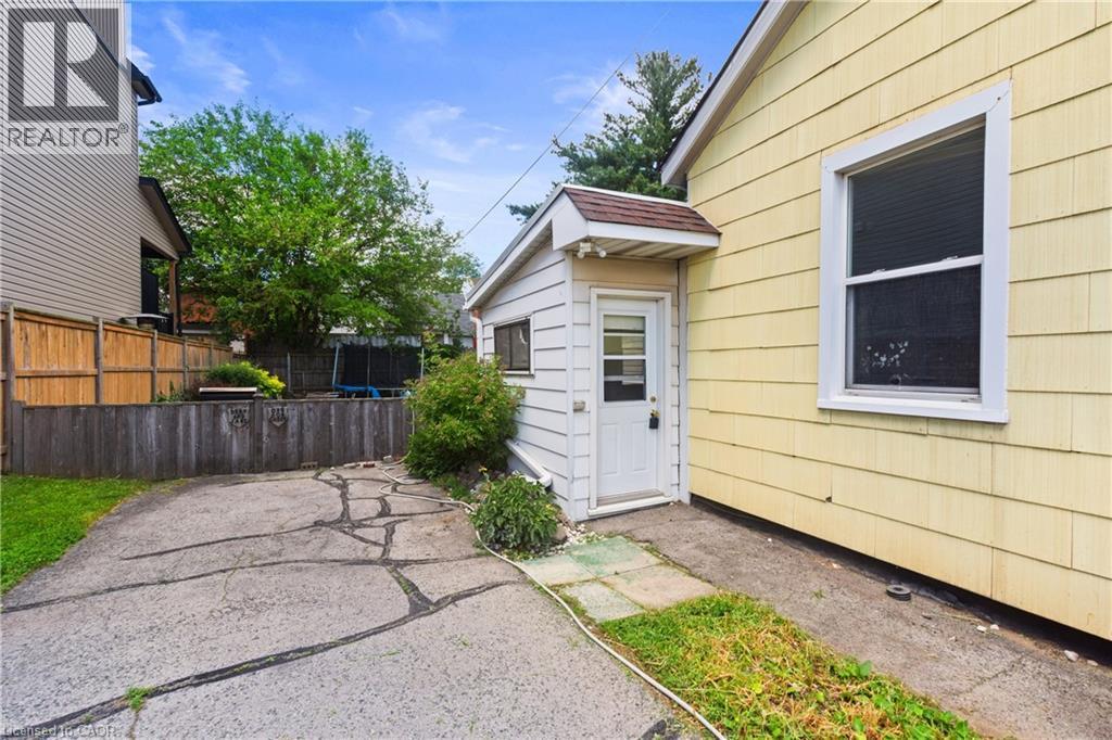 Driveway to the left side of the structure. - 193 Locke Street N, Hamilton, ON - Outdoor With Exterior