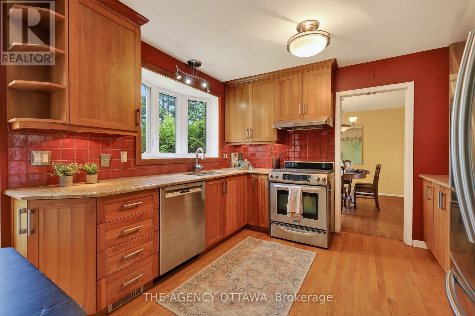 Open layout connects kitchen and dining areas - 1681 Amberdale Crescent, Ottawa, ON