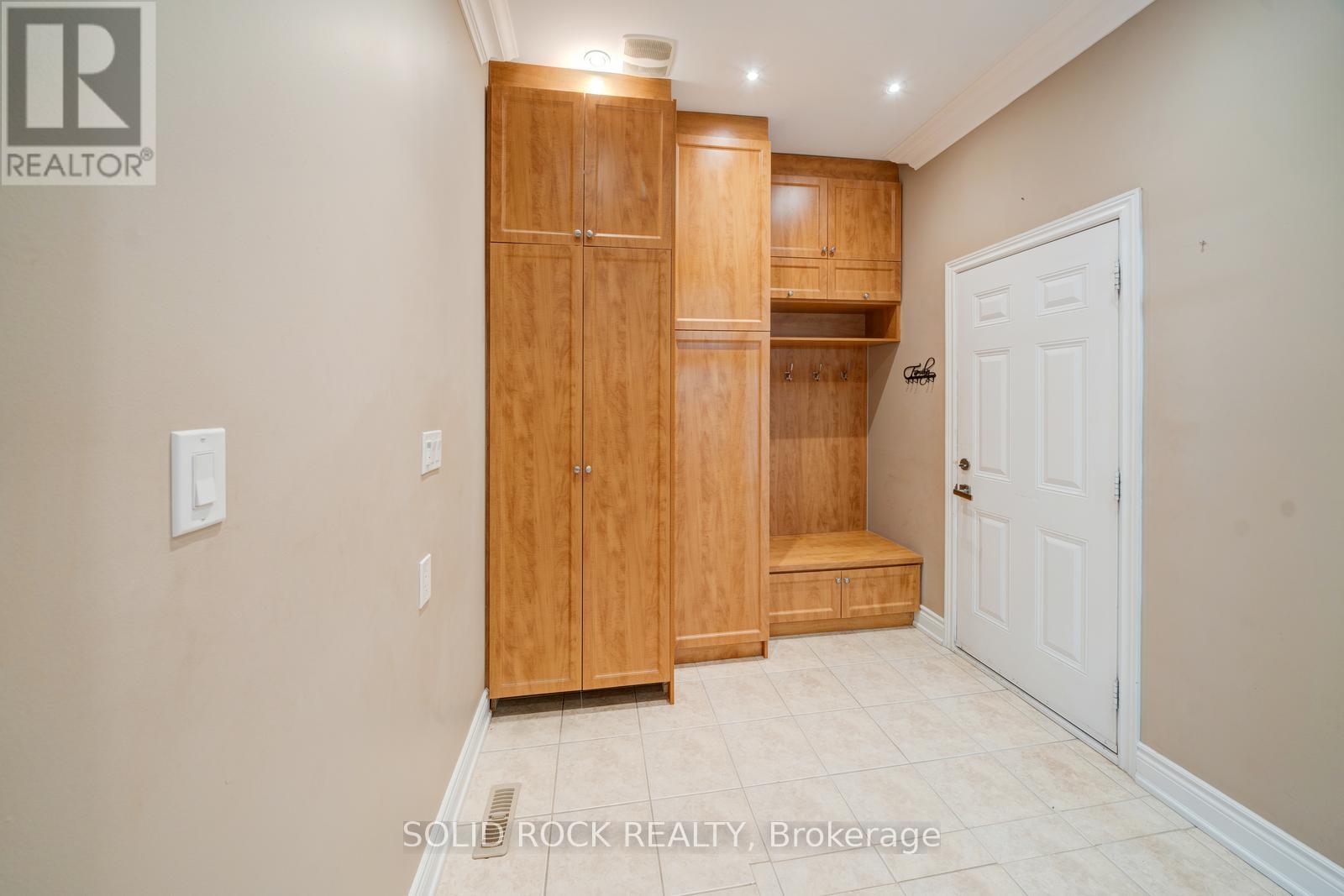 Mudroom with matching cabinetry and hidden laundry - 32 Albert Roffey Crescent, Markham, ON