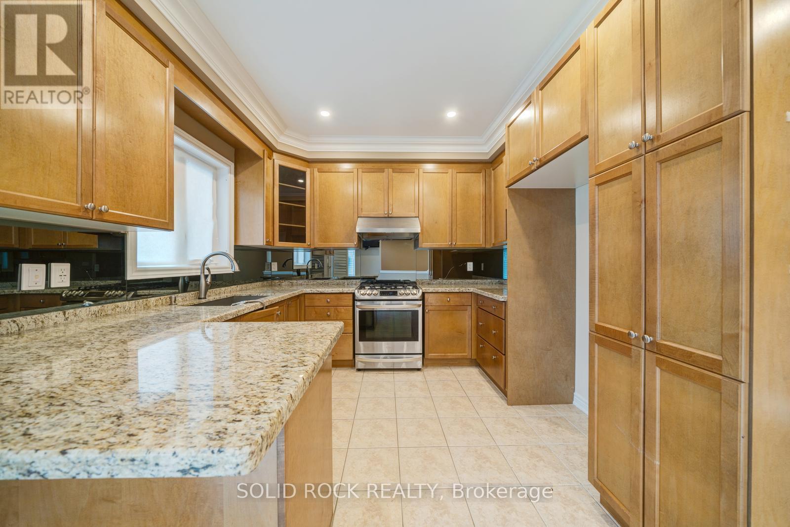 Kitchen with potlights and stone counters - 32 Albert Roffey Crescent, Markham, ON