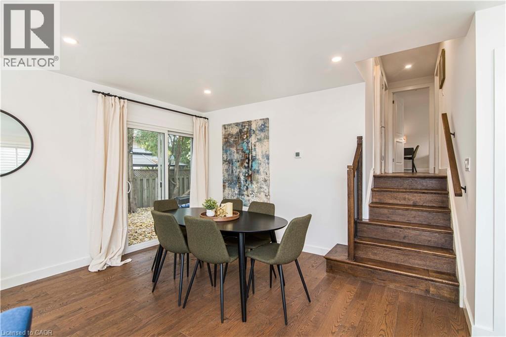 Wood-finish flooring throughout, featuring a staircase with wood treads and handrails - 39 Forestgate Drive, Hamilton, ON