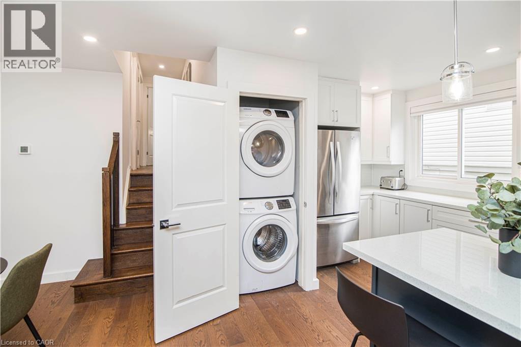 Efficiently designed laundry closet with stacked appliances - 39 Forestgate Drive, Hamilton, ON