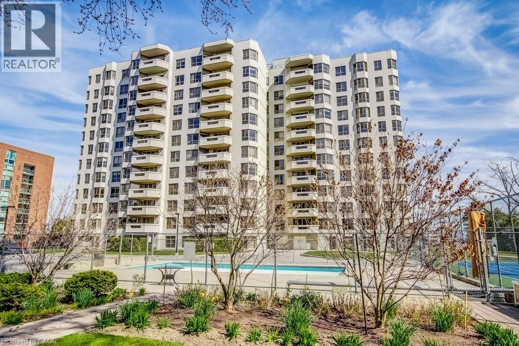Multi-story residential building featuring numerous private balconies - 1201 North Shore Boulevard E Unit# 706, Burlington, ON - Outdoor With Facade