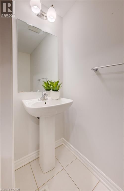 Bathroom with baseboards and light tile patterned floors - 302 Jean Landing, Milton, ON