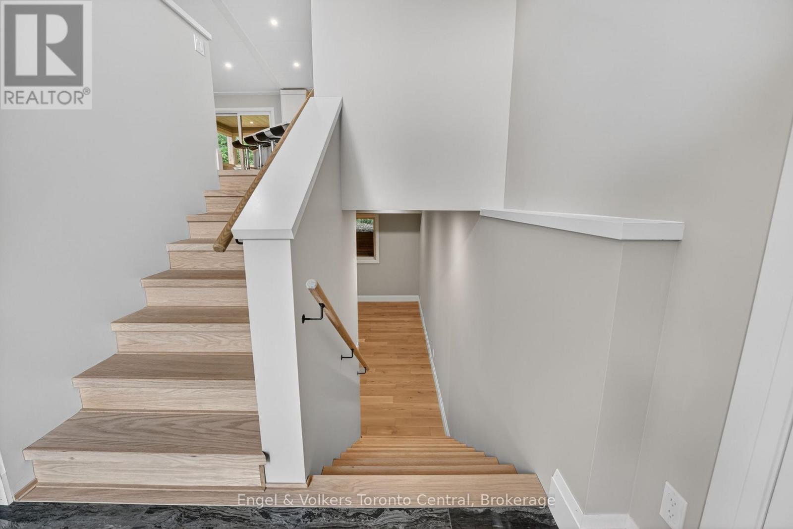 stairs from entry to upper level and lower levels - 1093 Highway 141 Drive, Seguin, ON