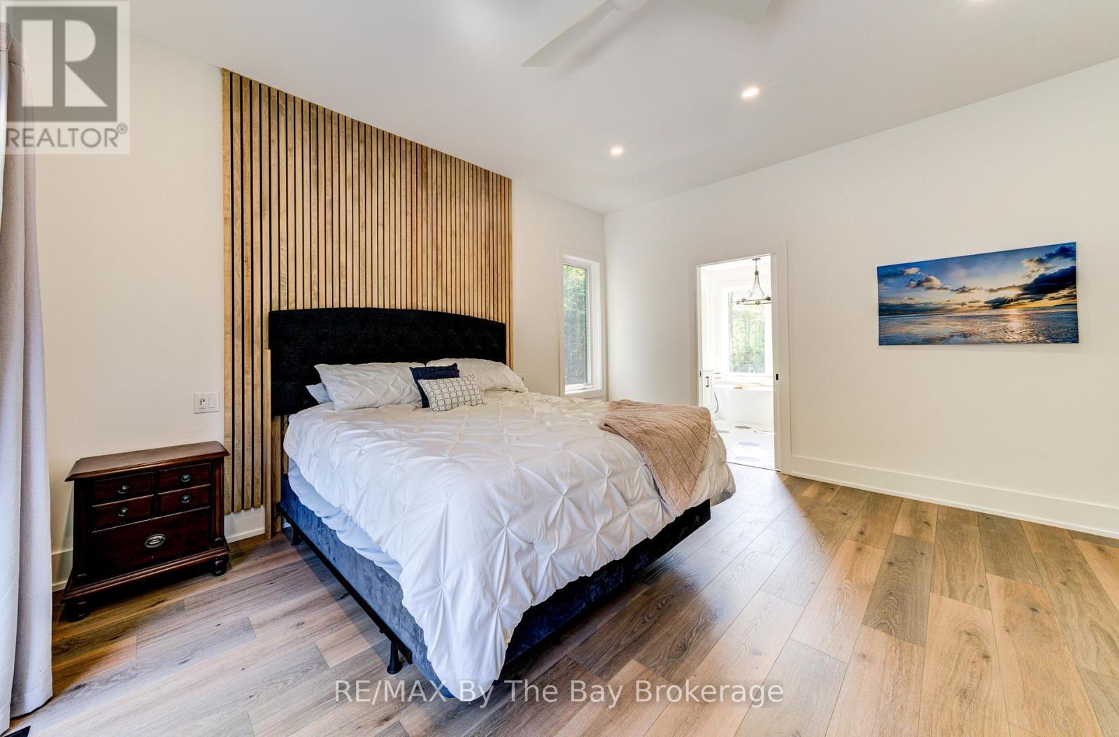 Primary Bedroom with Feature Wall - 95 Spruce Street, Tiny, ON