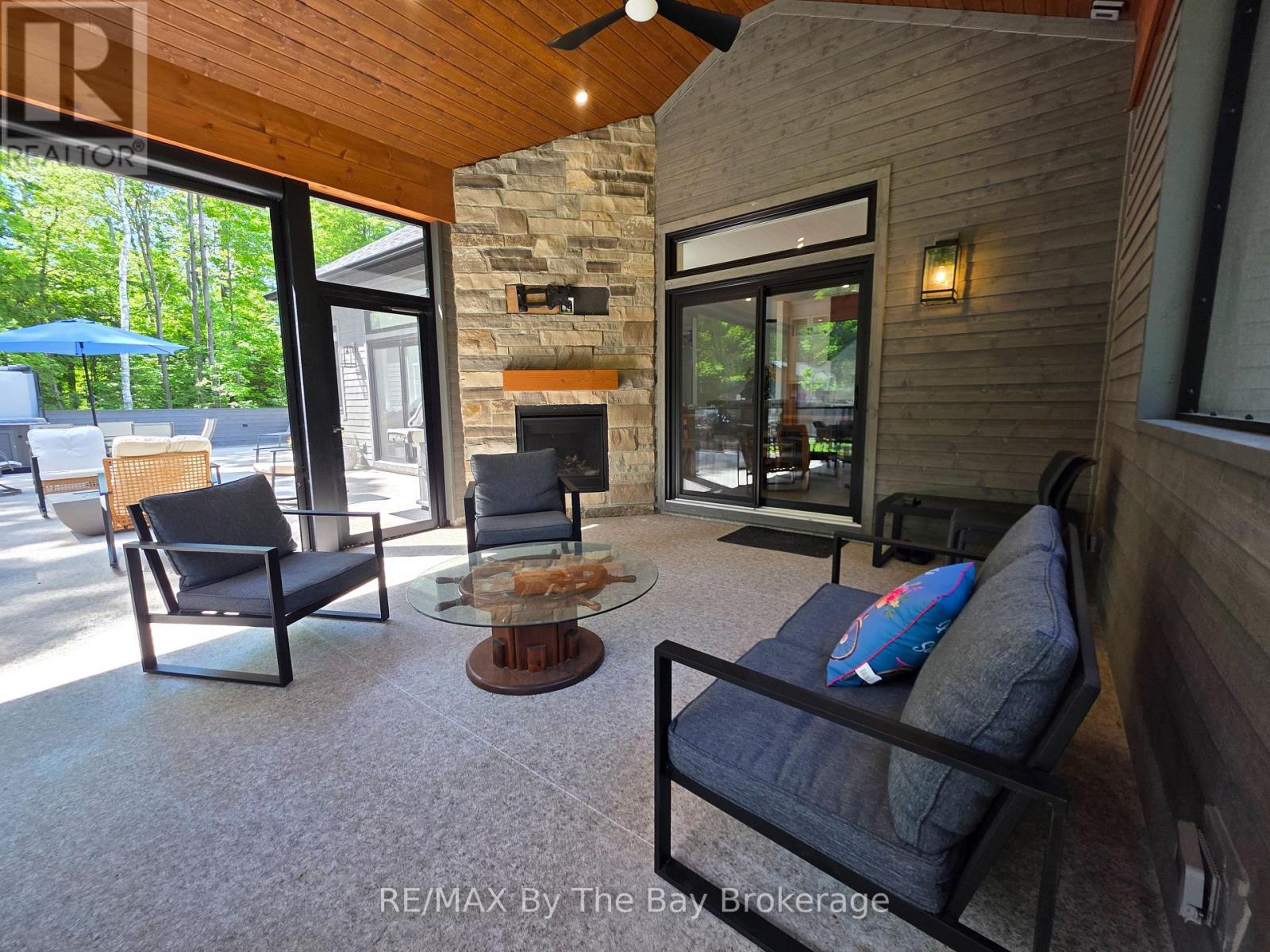 Porch with Screen Open for Access to Deck Area - 95 Spruce Street, Tiny, ON