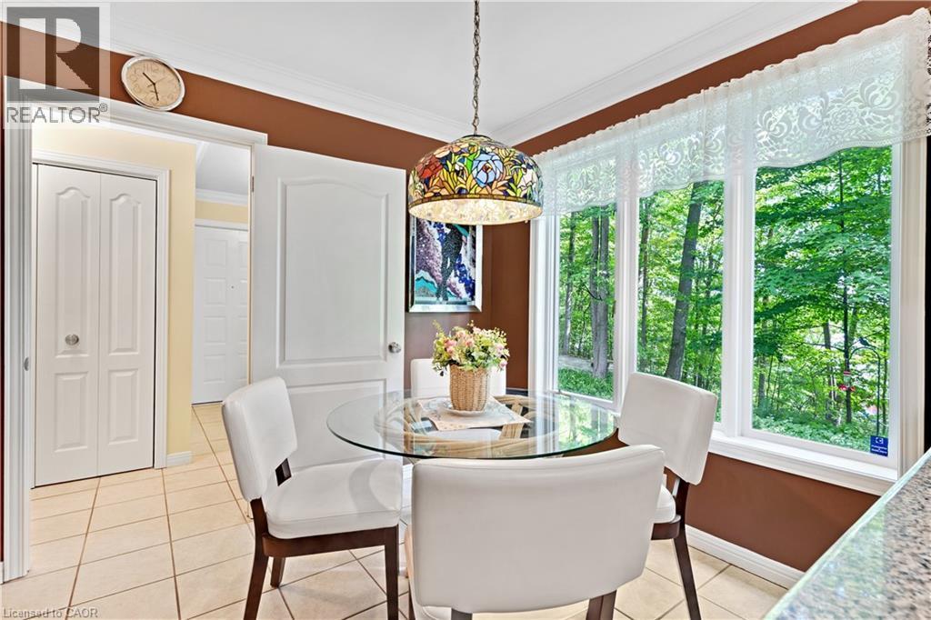 Expansive window offering a verdant treeline backdrop - 110 Grand Ridge Drive, Cambridge, ON