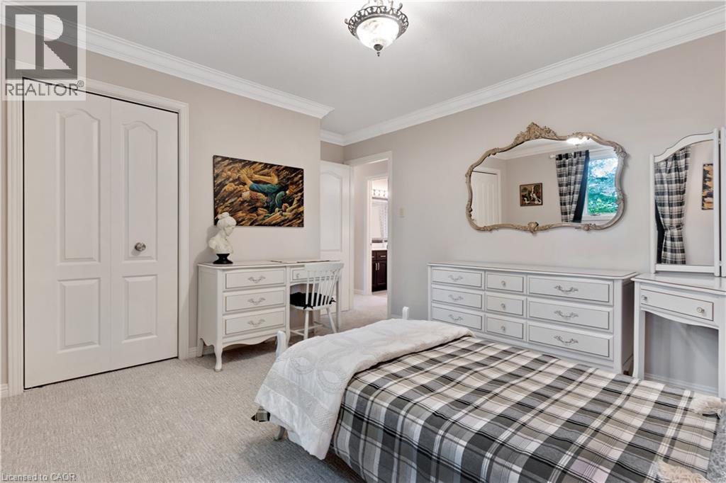 Recessed lighting illuminates the room, featuring light-toned walls and crown molding - 110 Grand Ridge Drive, Cambridge, ON