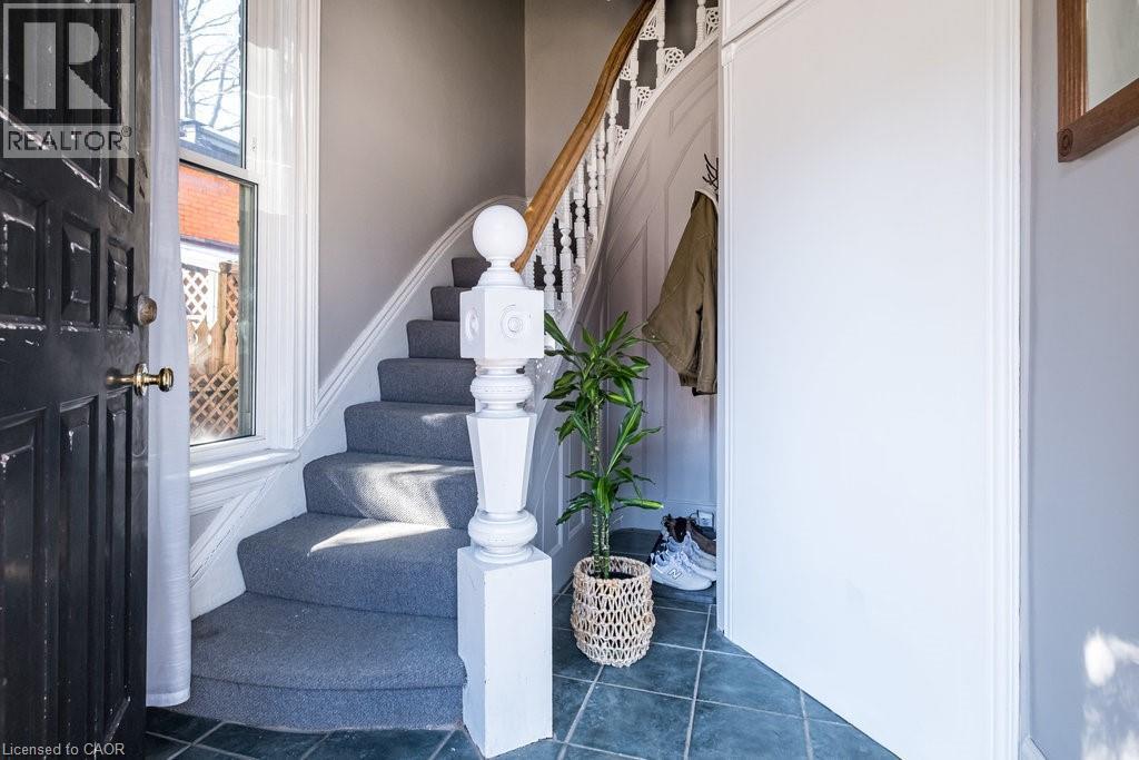 Main floor entrance to the second level unit. All three units feature their own private entrances, offering added privacy and independence for each resident. - 270 Queen Street S, Hamilton, ON