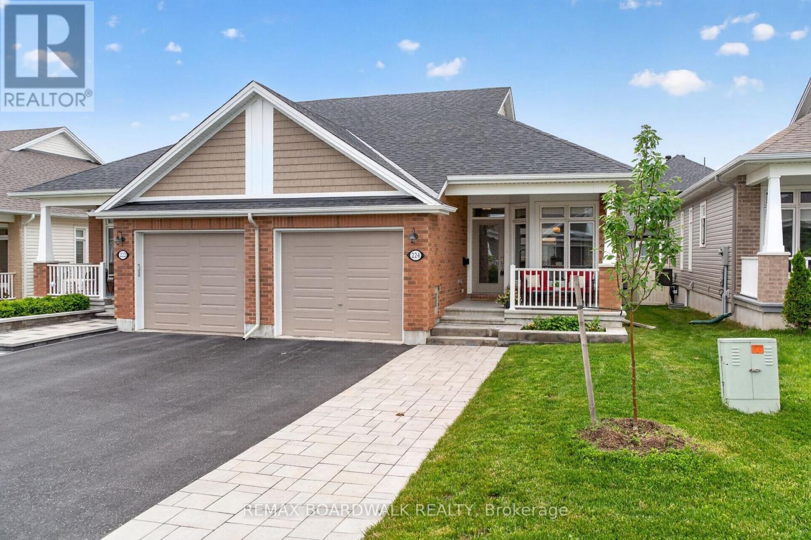 Extended Front Interlock Driveway & Garden Box - 224 Maygrass Way, Ottawa, ON - Outdoor With Deck Patio Veranda With Facade