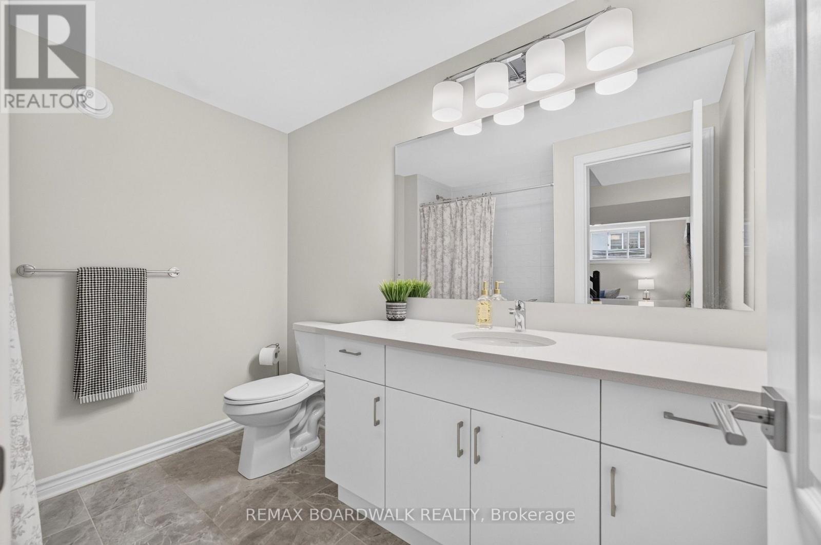 Basement 4PC Bath w/Tile Floors & Quartz Counters - 224 Maygrass Way, Ottawa, ON - Indoor Photo Showing Bathroom