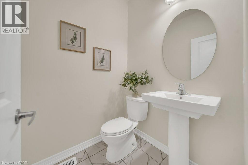 Bathroom featuring toilet and marble finish floors - 285 Broadacre Drive, Kitchener, ON