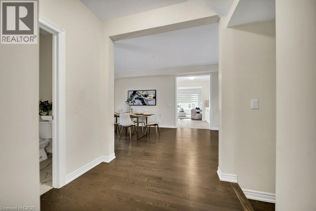 Hall featuring dark wood-type flooring and baseboards - 285 Broadacre Drive, Kitchener, ON