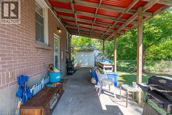 Back covered porch/ rear & lower level entrance -