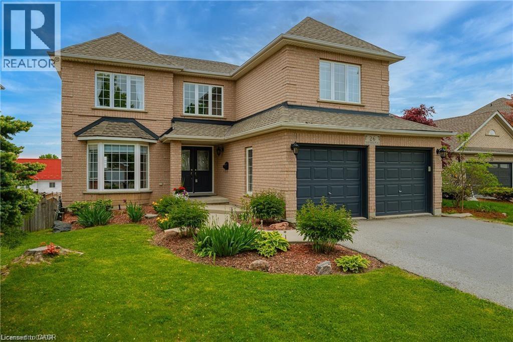 Two-story brick residence with an attached two-car garage - 26 Shadyridge Place, Kitchener, ON