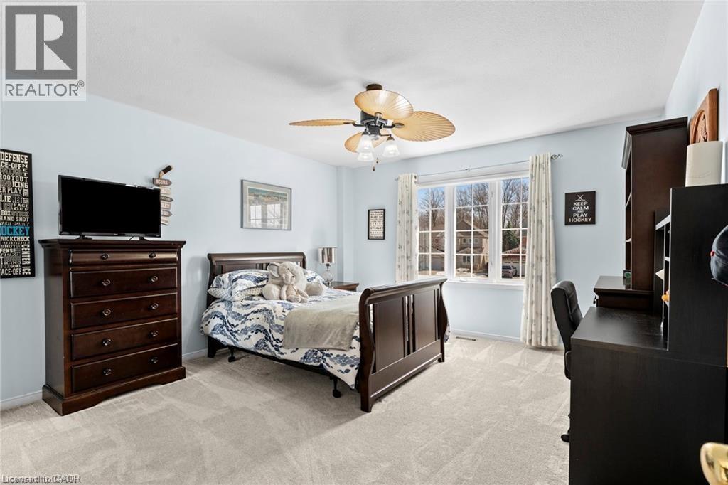 Light blue painted walls with light-colored carpeting - 26 Shadyridge Place, Kitchener, ON