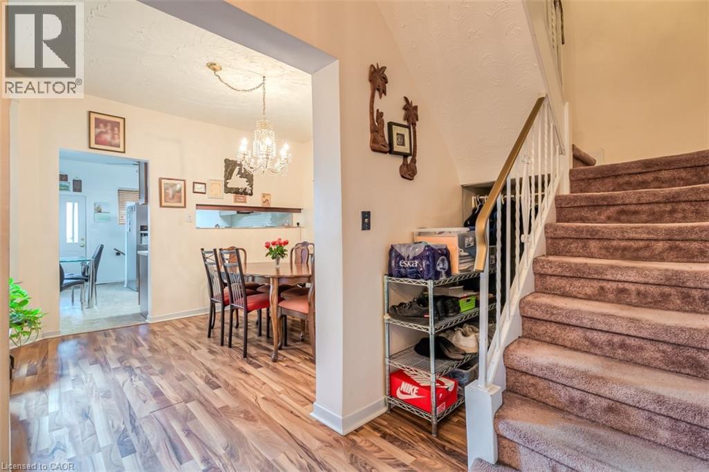 Wood-finish flooring throughout the main level - 41 Springhurst Avenue, Toronto, ON