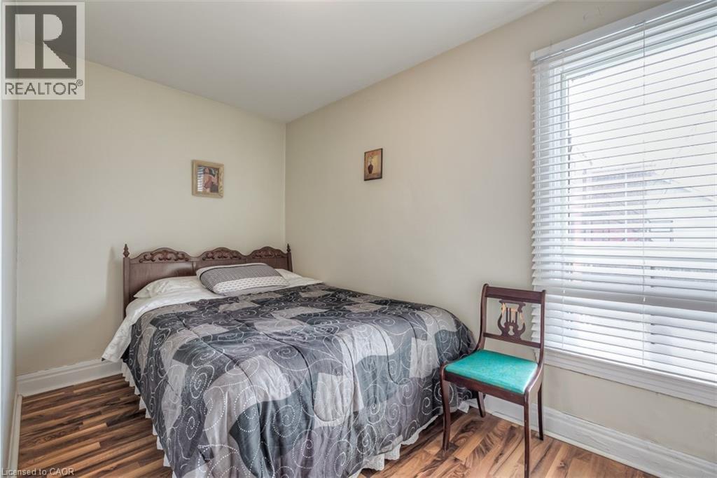 Warm-toned walls complement the wood-finish flooring - 41 Springhurst Avenue, Toronto, ON