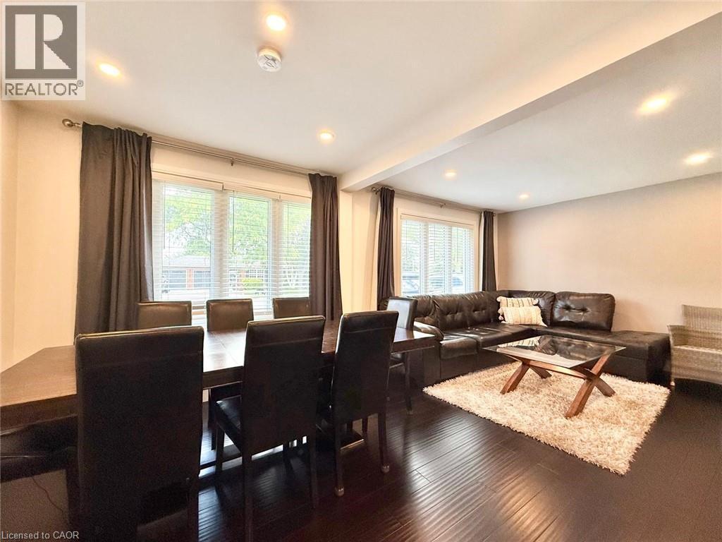 Open concept living area with dark wood-finish flooring - 3135 Palmer Drive, Burlington, ON