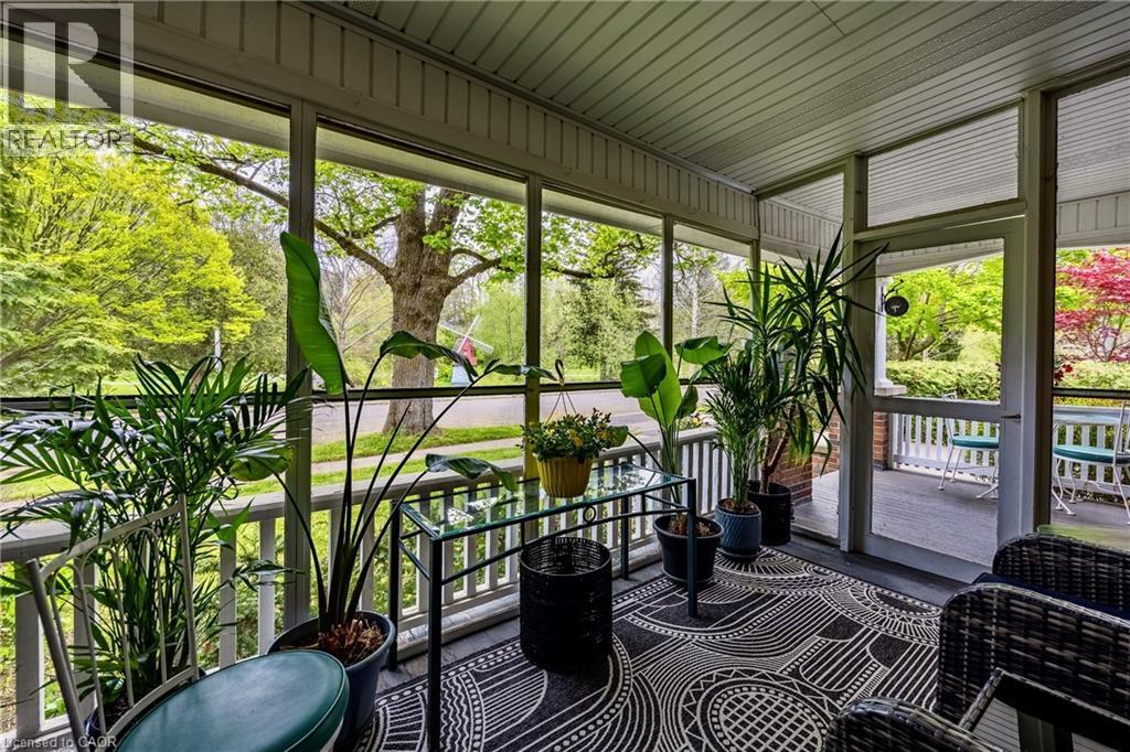 Screened-in front porch overlooking Clifton Park and Dingle Creek - 72 Crescent Boulevard, Simcoe, ON - Outdoor With Deck Patio Veranda With Exterior