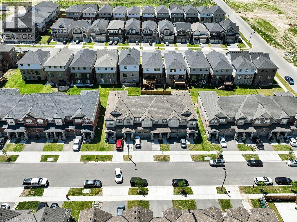 Aerial perspective showcasing a collection of residential properties - 76 Grassbourne Avenue, Kitchener, ON