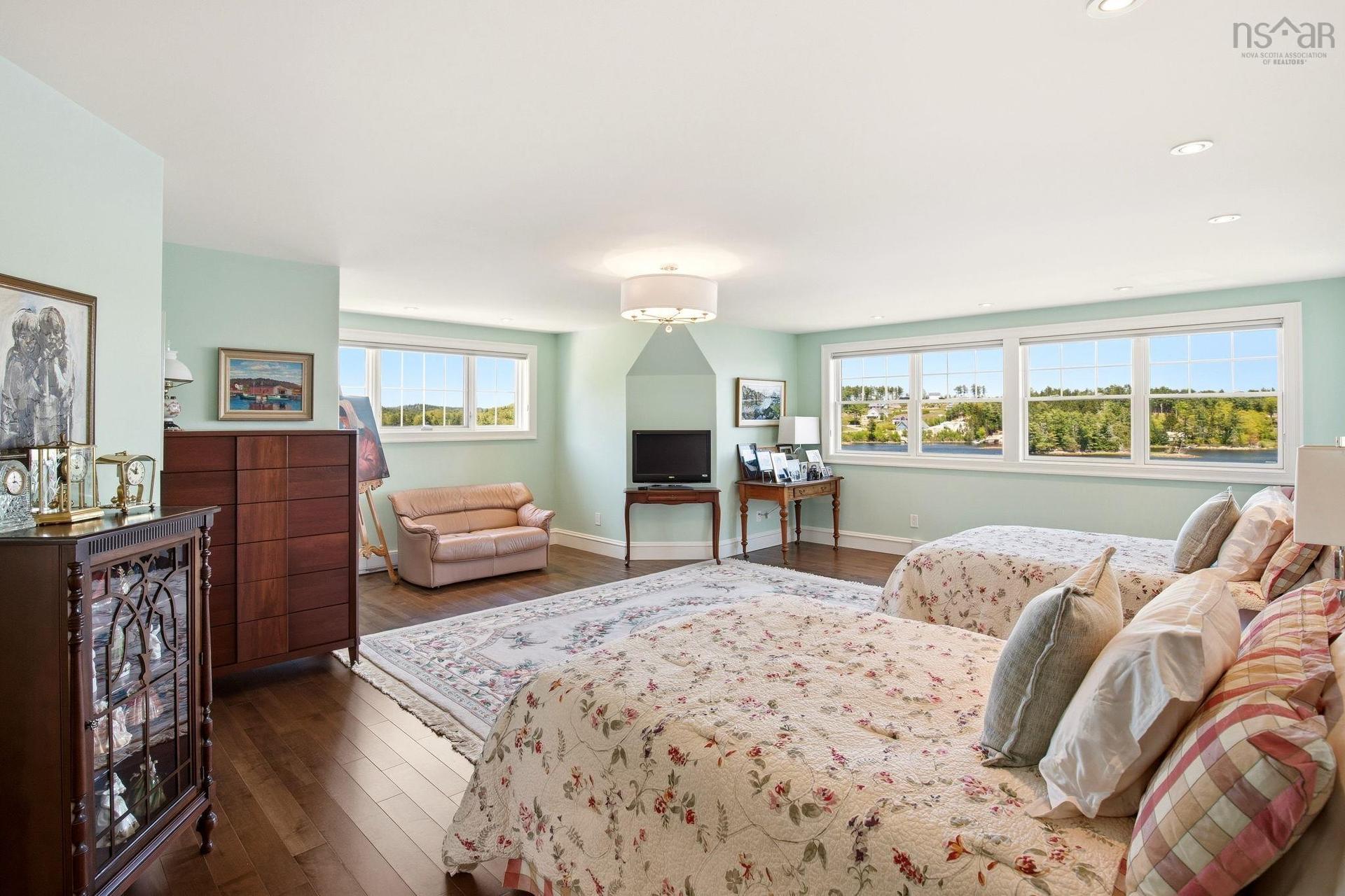 6 Mary Lane, Chester Basin, NS - Indoor Photo Showing Bedroom With Fireplace