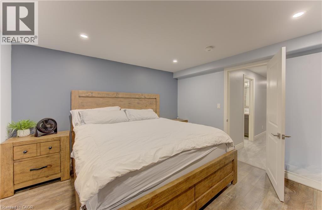Bedroom featuring recessed lighting and wood-finish flooring - 127 Strathcona Crescent, Kitchener, ON