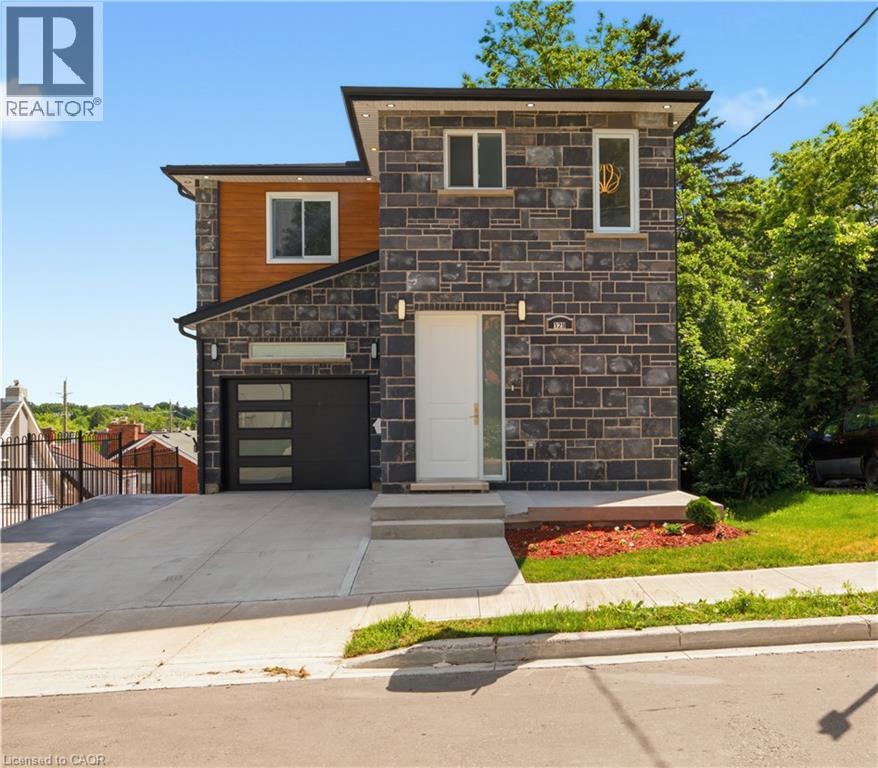 Modern exterior with varied stone and wood-tone siding - 129 St George Street, Kitchener, ON
