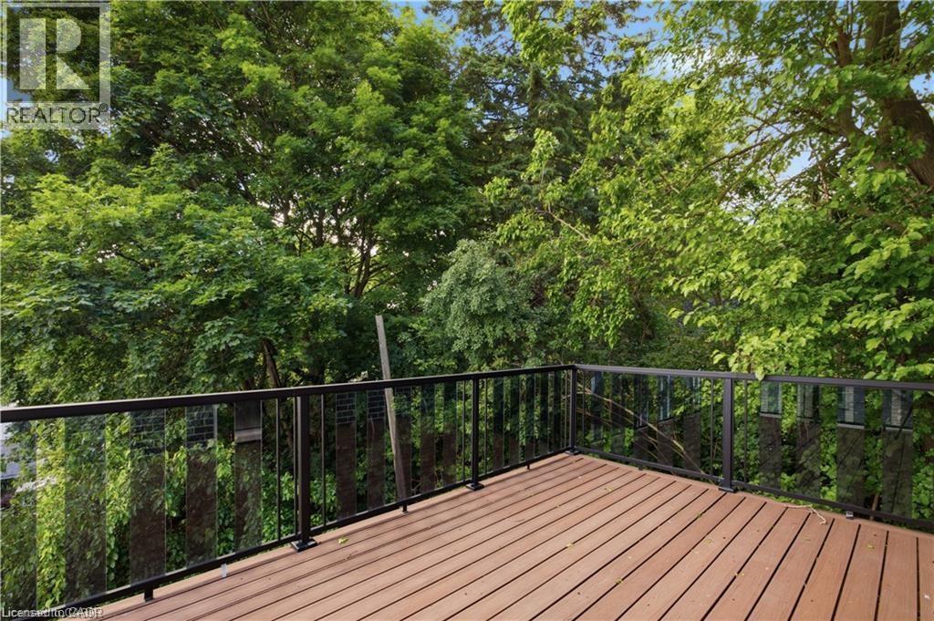 Expansive outdoor deck featuring wood-finish flooring - 129 St George Street, Kitchener, ON