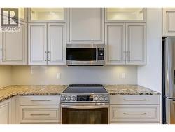 Beautifully updated kitchen with granite counters and stainless steel appliances -