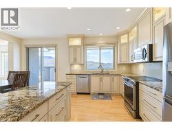 Beautifully updated kitchen with granite counters and stainless steel appliances -