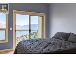 Primary with lake views plus access to private deck -