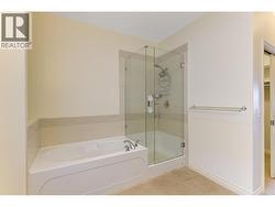 Spacious ensuite with dual vanities, granite counters, soaker tub and shower -
